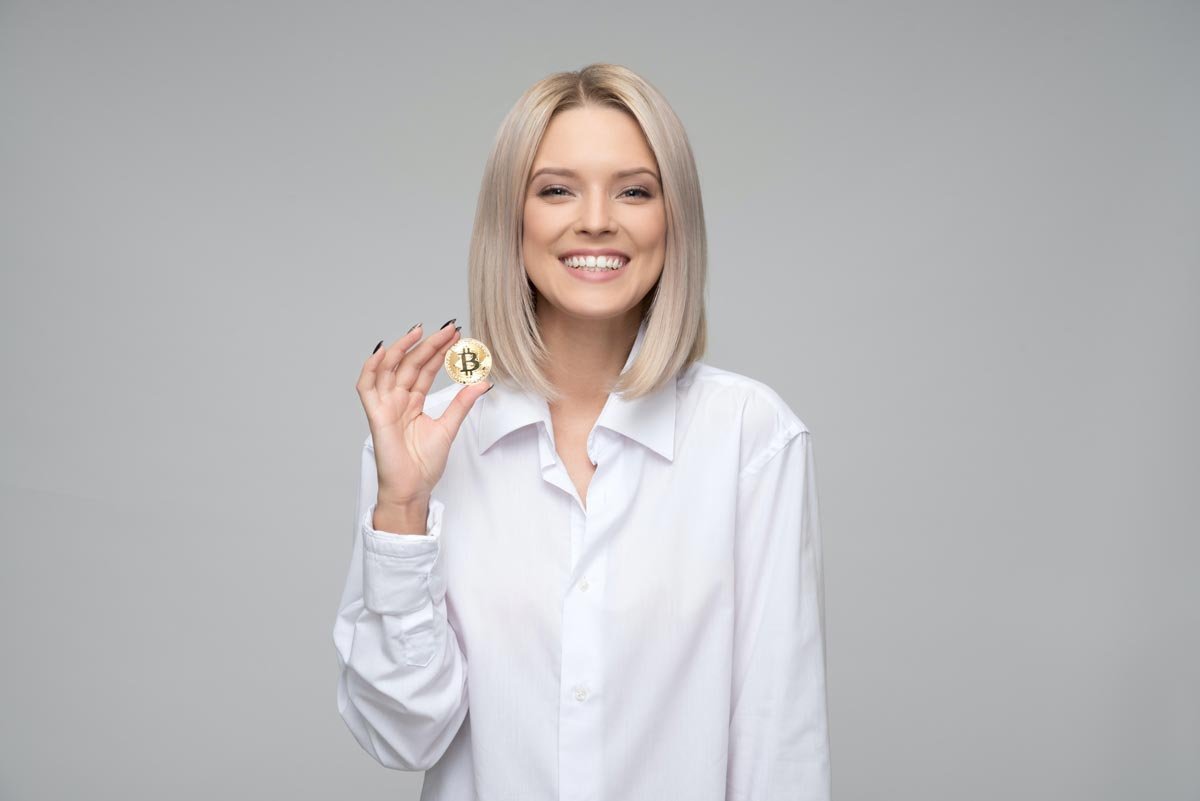 Immediate Bitcoin girl holding crypto